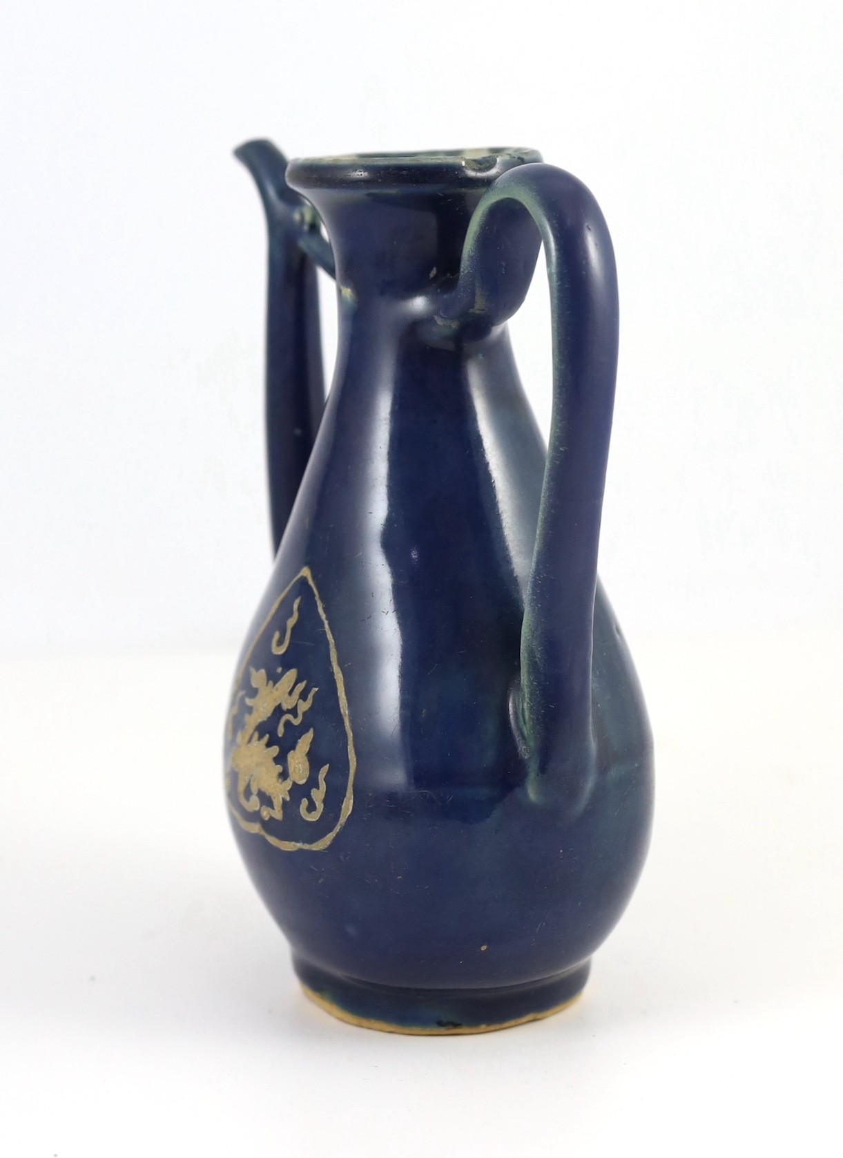 A Chinese late Ming blue glazed and slip decorated ‘qilin’ ewer, for the Islamic market, 19.5cm high, handle and tip of spout restored, wear